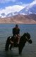 China: Kirghiz horseman at Lake Karakul on the Karakoram Highway, Xinjiang